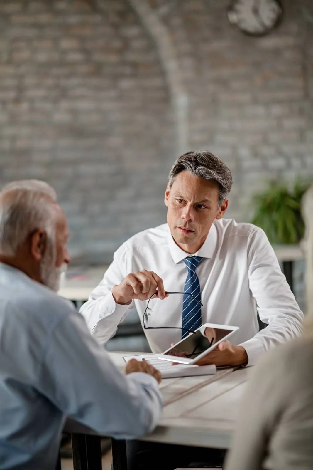 Insurance specialist meeting with retired client